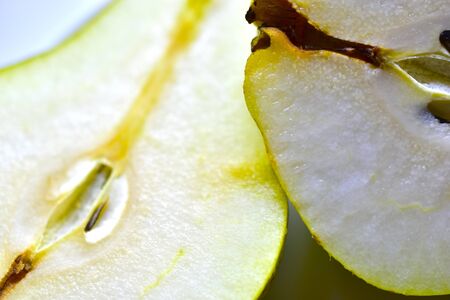 The heart of a green ripe pear in macrophotographyの写真素材