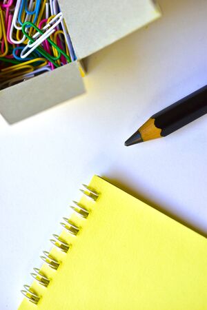 Black large pencil and Notepad and paper clipsの写真素材