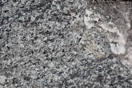 Construction masonry of rough stones in the house and fenceの写真素材