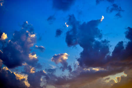 Blue sky with beautiful blue red clouds in the eveningの写真素材