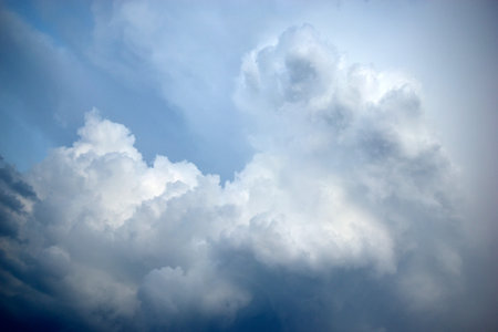 Pre-storm Cumulus blue clouds in the evening sky