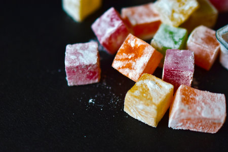 Delicious Oriental sweets Turkish delight on a black background