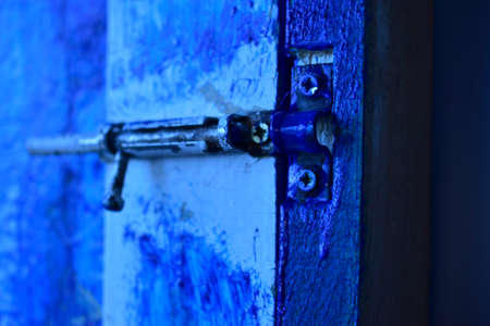 Just an iron lock on the door a blue boltの写真素材