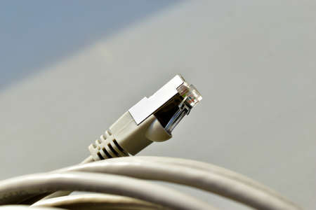 LAN input cable patch cord white cord on white backgroundの写真素材