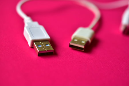 Three white USB connectors on a red background