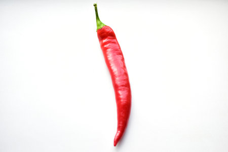 Fresh red capsicum on a white background