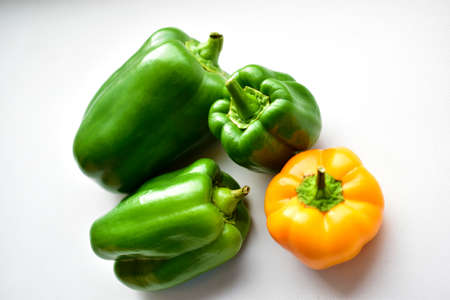 Yellow green regular pepper on a white backgroundの写真素材