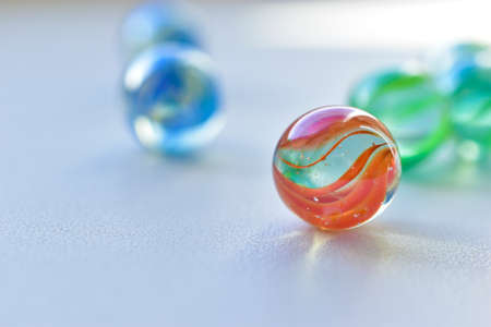 Decorative multicolored glass balls on a white backgroundの写真素材