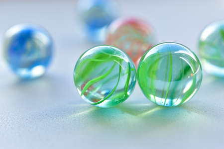 Decorative multicolored glass balls on a white backgroundの写真素材