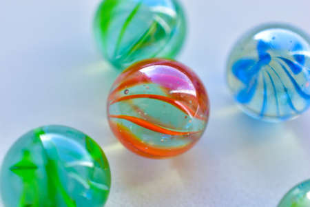 Decorative multicolored glass balls on a white backgroundの写真素材