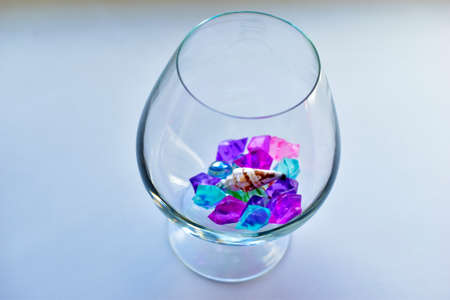 Colorful crystals and balls in a glass glassの写真素材