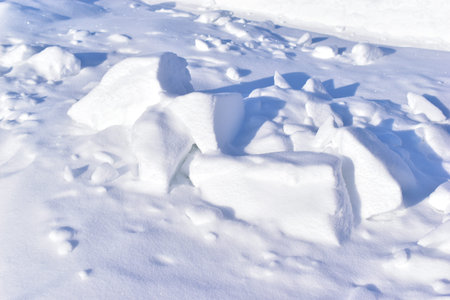 White blocks of snow in the winter afternoon