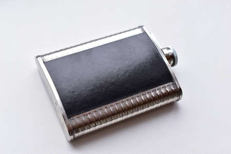 Iron flask for water or alcohol on a white backgroundの写真素材