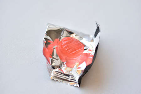 Red lollipop candy on white backgroundの写真素材