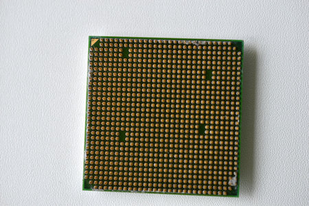 Computer processor with contact legs on a white background