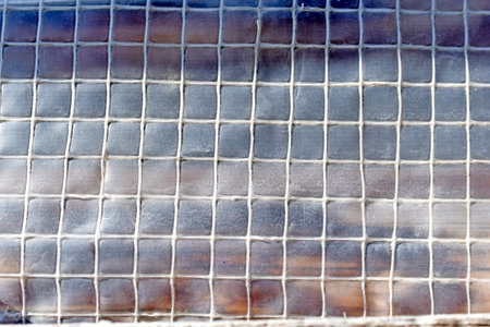 Polyethylene mesh surface in the garden in summerの写真素材