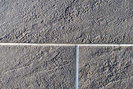 Gray ceramic tiles on the wall of the houseの写真素材