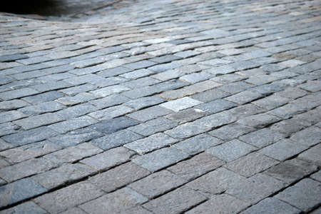 An old stone and tile walkway in the cityの写真素材