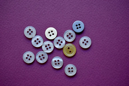 White round buttons on a purple background