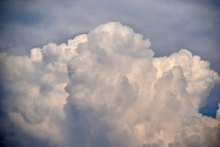 Blue and white cumulus clouds before a thunderstorm