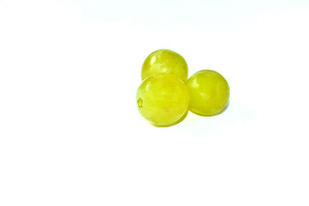 Three green grapes on a white background macroの写真素材