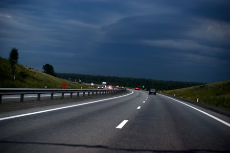 Expressway in the evening with cars and scenery