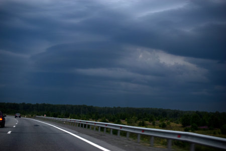 Expressway in the evening with cars and sceneryの写真素材