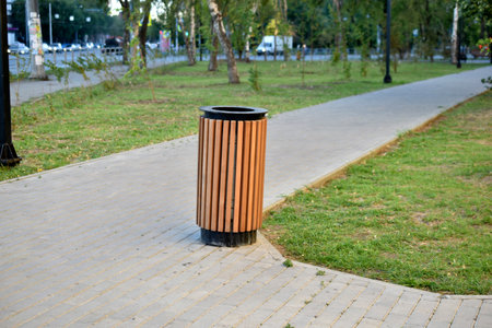 City park with garbage cans and flower bedsの写真素材