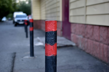 Red and black fences in the city in the parking lot