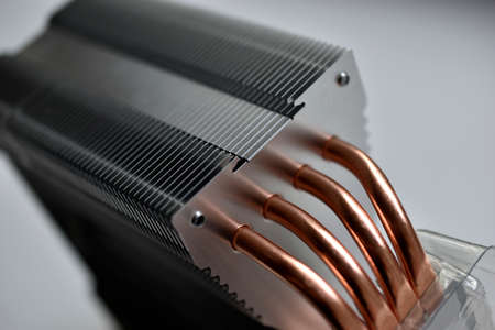 Silver aluminum CPU radiator with copper cooling tubes close-upの写真素材