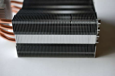 Silver aluminum CPU radiator with copper cooling tubes close-upの写真素材