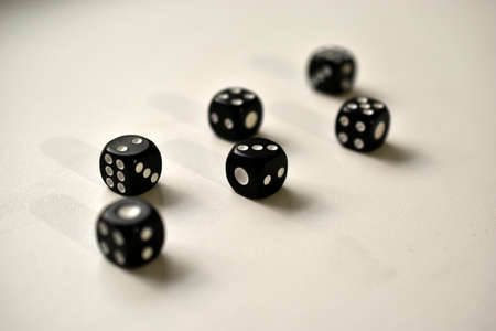 Dice in black and white on a white backgroundの写真素材