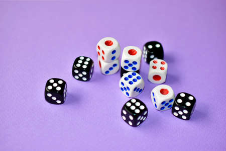 Dice are black and white on a purple backgroundの写真素材