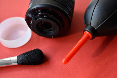 Means for cleaning photo optics. An air bag and a cleaning brush.の写真素材
