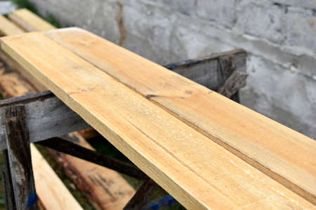 Pine white construction boards at the sawmillの写真素材