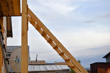 Wooden staircase at the garden house in flowersの写真素材