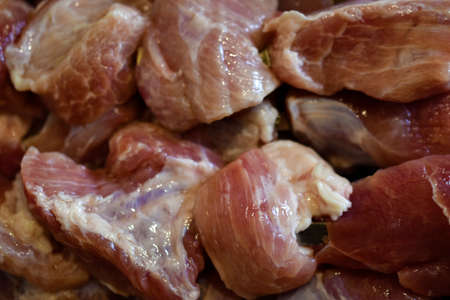 Raw pork meat on a barbecue skewerの写真素材