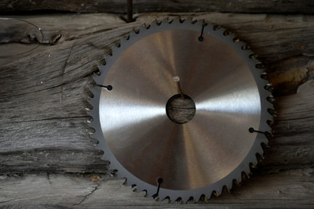 Iron circular saw disk close-up in the garage