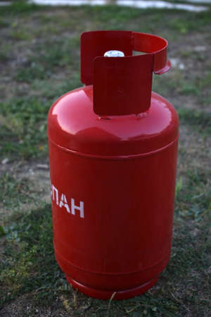 Red gas household bottle with shiny valveの写真素材