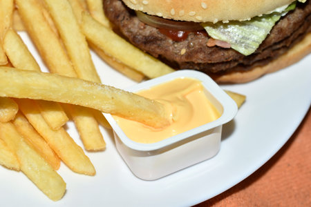 Triple meaty delicious hamburger with nice fries