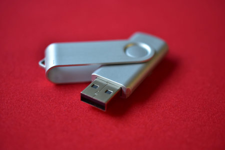 USB flash drive on a red velvet background