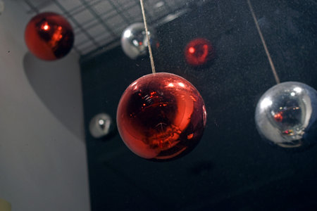 Christmas decorations balls and garland decorations in shop windowsの写真素材