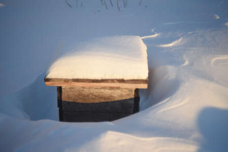 Wooden boxes for flowers under the snow in winterの写真素材
