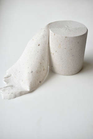 Close-up toilet paper roll isolated on white backgroundの写真素材