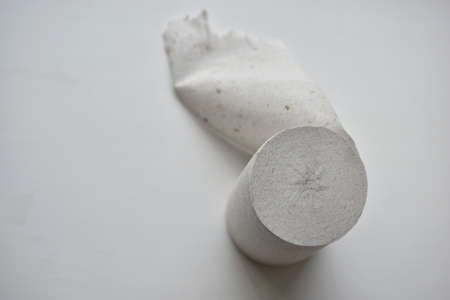 Close-up toilet paper roll isolated on white backgroundの写真素材