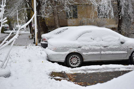 Cars in the winter in the snow after a snowfallの写真素材