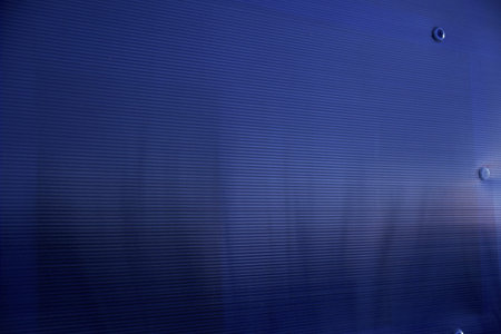 Striped blue polycarbonate in the rays of the evening sun