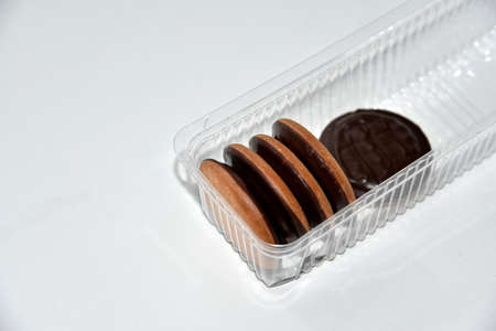 cookies covered with chocolate round delicious on a white backgroundの写真素材