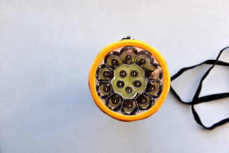Yellow LED flashlight on white background