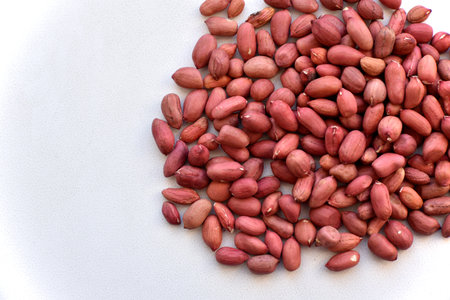 Red peanuts on a white backgroundの写真素材